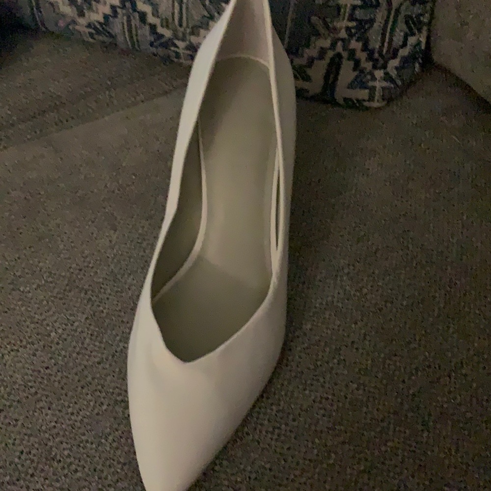 All white chunky heels. Size 11. Never Worn. Scuffed on the side. Tags on it
